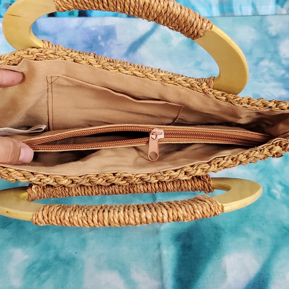 Tan-brown woven handbag with wooden handles